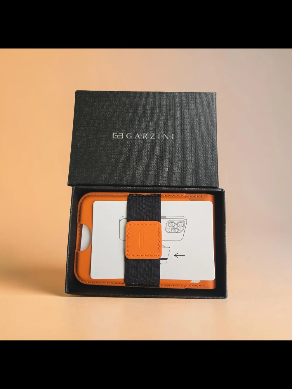 Orange Leather Card Holder with Elastic Strap.